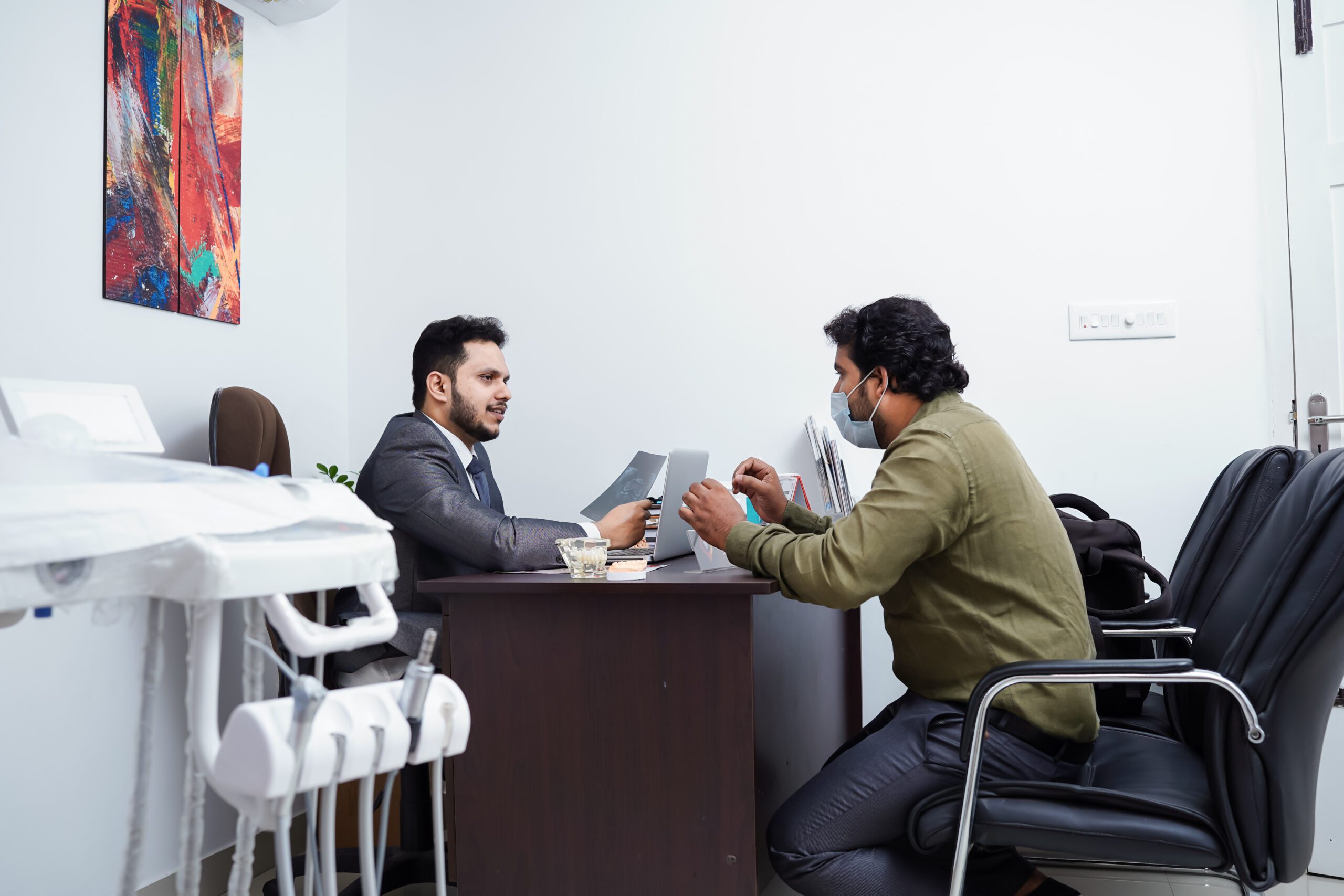 Dr Akhil Mohan Talking to Patient at Dental point