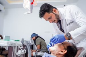 Dr Akhil Mohan Examining Patient at Dental point